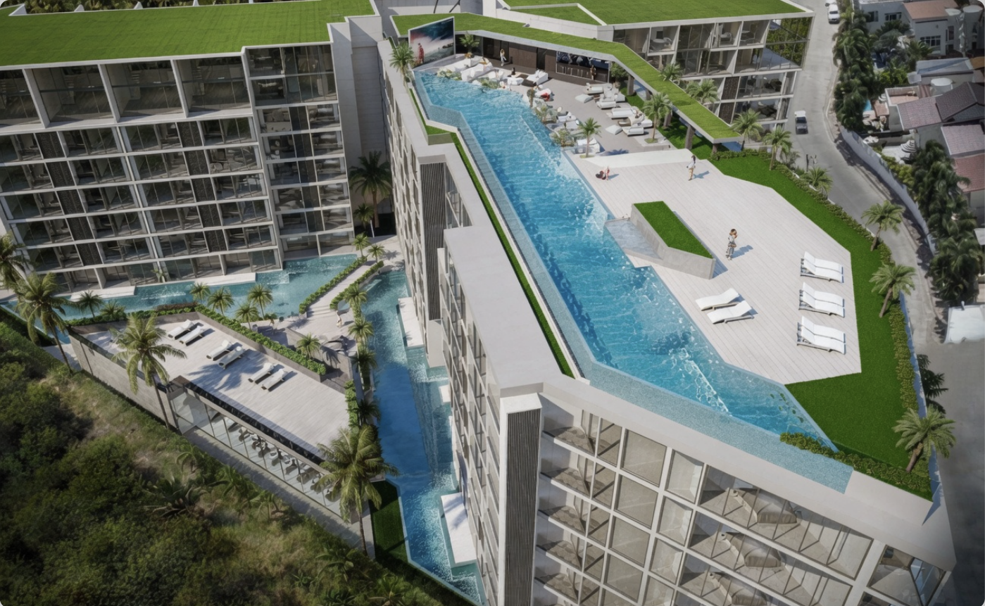 Luftaufnahme des Infinity-Pools auf der Dachterrasse mit Loungebereich